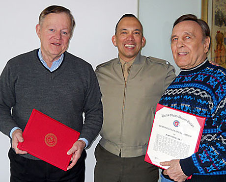 Col. Brian Salas, director of public affairs, Marine Corps, (c) stands with photo judges Red Stucky (l) and John Metelsky after handing them certificates of appreciation from Gen. James F. Amos, Marine Commandant, for their volunteer work as judges in the annual Merit Awards competition. They reviewed some 300 entries in a dozen categories.