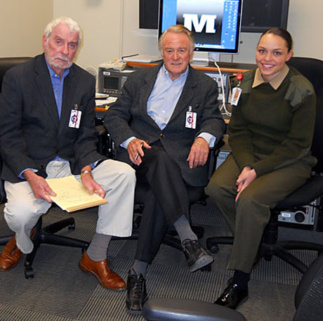 Judges Patrick McGrath (l) and Don North, veteran television cameramen and journalists, take a break during a long day of reviewing broadcast entries in the Merit Awards program. Cpl Sydney Purschwitz, CMA unit, displayed the visuals in the broadcasting session.
