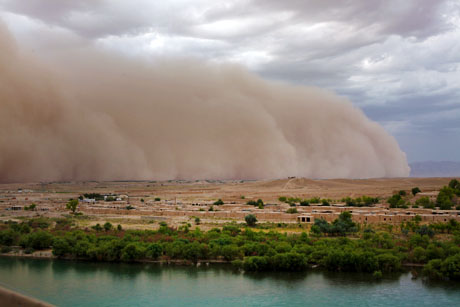 A dust storm rolls through the Kajaki Bazaar outside of Forward Operating Base Zeebruge, Helmand province, Afghanistan, June 3, 2013. (U.S. Marine Corps photo by Lance Cpl. William M. Kresse RCSW Combat Camera)