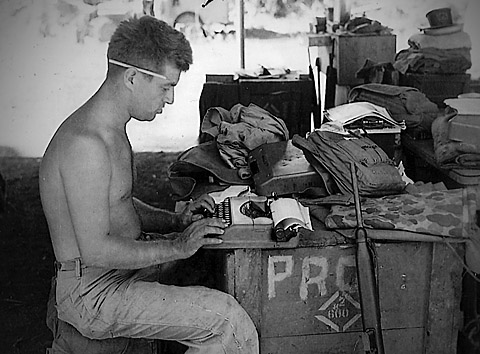 In this 1944 photo, Cyril 'Cy' O'Brien, a former Marine combat correspondent, uses a typewriter on Guam.