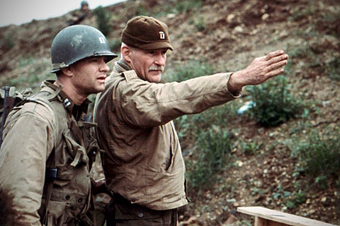 Dale Dye, right, directs Tom Hanks on the set of Steven Spielberg's