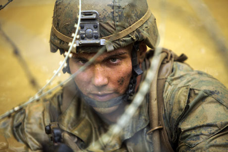 One of last years' entries was a photo by Sgt. Henry Antenor: Cpl. Wesley W. Robertson surfaces after submerging underneath logs and concertina wire during the Jungle Endurance Course at Camp Gonsalves. Robertson is an infantryman with Company K, Battalion Landing Team 3rd Battalion, 5th Marines, 31st Marine Expeditionary Unit, and a native of Denton, Texas. Multiple obstacles make up the endurance course, which tests physical and mental stamina, as well as unit cohesion. The 31st MEU is the force of choice for the Asia-Pacific region and is the only continuously forward-deployed MEU.