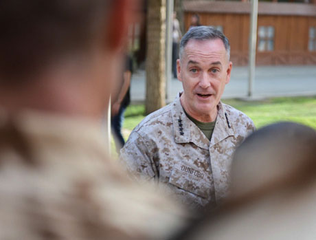 In this 2013 photo, U.S. Marine Corps Gen. Joseph F. Dunford Jr., commander of International Security Assistance Force addresses Romanian troops prior to their redeployment