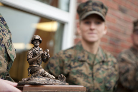 The Cpl. William T. Perkins Jr. Award, is presented to Cpl. Katelyn M. Hunter, machine gunner, Weapons Company, Ground Combat Element Integrated Task Force, 2nd Marine Division (MARDIV) on Jan. 7, 2015 at Camp Lejeune, N.C. She earned this award for her imagery taken throughout the 2014 calendar year, while attached to the Consolidated Combat Camera Facility, Okinawa, Japan. The award commemorates the only combat photographer to have ever been awarded the Medal of Honor, which he received for his heroic efforts during the Vietnam War. (Photos by Lance Cpl. Kelly Timney, 2nd MARDIV Combat Camera)