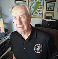 Jack Paxton models a shirt featuring the new logo. 