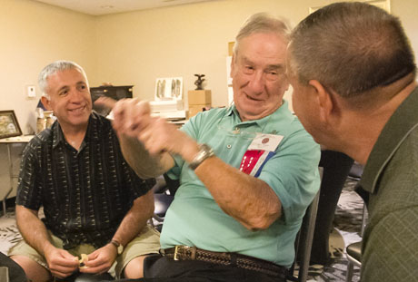 Newly elected USMCCCA president, Manny Pacheco laughs at a story Jack Paxton tells to Walt Ford.