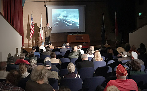 Tom Graves describes the 1945 battle of Iwo Jima and Rosenthal’s flag raising photo to the audience at the San Leandro, Calif. Public Library.
