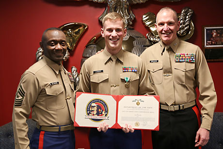 Sgt. Reece E. Lodder, Marketing and Public Affairs Marine, Recruiting Station Seattle, received the award of fiscal year 2014 MPA of the Year from Maj. Gen. Mark A. Brilakis, commanding general, Marine Corps Recruiting command, during a ceremony here. Lodder was also awarded the Navy and Marine Corps Commendation medal for his efforts. MPAs serve as force multipliers to the Marine Corps’ advertising programs within the Recruiting Command, and assist in generating leads for the recruiters. Pictured from left to right are Sgt. Maj. Samuel Heyward Jr., Sergeant Major, MCRC, Sergeant Reece E. Lodder and Maj. Gen. Mark A. Brilakis