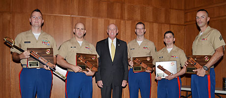 In a Marine Corps Recruiting Command ceremony at the Gray Research Center auditorium, MCB Quantico, Sept. 21, the Marine Corps Association & Foundation and the U.S. Marine Corps Combat Correspondents Association recognized the Marketing and Public Affairs Marines of the Year with Ka-Bar plaques to the top MPA Marine from each of the six regional districts and an NCO sword to one of the six outstanding MPAs named MPA of the Year. Pictured from the left is MPA of the Year SSgt Clinton Firstbrook; SSgt Jeffery Cosola; MCA&F President and CEO, MajGen Edward Usher, USMC (Ret) who presented the awards on behalf of the MCA&F and the USMCCCA; Sgt Scott McAdam Jr.; Sgt Aaron Rooks; and Sgt Justin Kronenberg. The other award winner, Sgt Ronald Hendricks, was not in attendance. (photo by Ron Lunn, MCA)