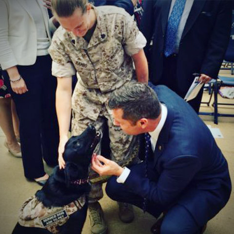 Former Combat Cameraman Jessica Rambo, USMC Sgt (ret) and her service dog Bella.