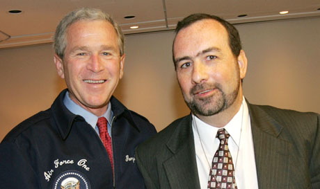 Former president George W. Bush and John Raughter.