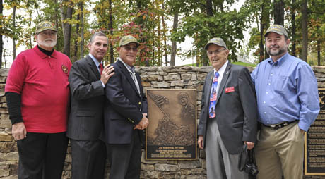 (left-right) Mr. Jack Withington, Lieutenant Gen. Jan Huly (USMC Ret), Mr. Leonard Cohen, designer of the bronze plaque, Mr. Dale Cook, President of the Joe Rosenthal Chapter of the U.S. Marine Corps Combat Correspondents Association (USMCCCA), and Mr. Tom Graves gather after the plaque dedication ceremony recognizing the achievements of former Associated Press photographer, Joe Rosenthal, held on the 102nd anniversary of his birth, at the Semper Fidelis Memorial Chapel, National Museum of the Marine Corps, Triangle, Va., Oct. 9, 2013. The plaque was presented by the San Francisco Bay Area Joe Rosenthal Chapter of the USMCCCA. Mr. Rosenthal had a long career as a news photographer but his most iconic image was that of the flag raising when the Marines took Iwo Jima during WWII on Feb. 23, 1945, earning him a Pulitzer Prize. (U.S. Marine Corps photo by Kathy Reesey/Released)