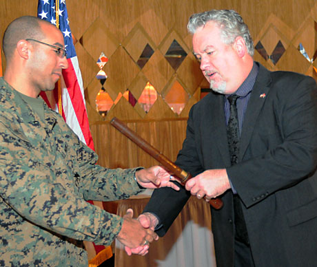 USMCCCA President Bill Hauptfleisch presents a belaying pin, symbolizing the new leadership of the Maryland (DINFOS) Chapter to Sgt. Shawn Sales during luncheon ceremonies at DINFOS on November 16. Sales was recently honored with the 2012 Department of Defense Illustrator of the Year award. He is an instructor at DINFOS. (Photo by Rick Corral)