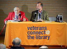 Chapter President Dale Cook, left, and Tom Graves answer questions.