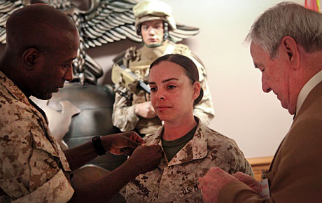 A Director's Promotion -- USMCCCA Board member Brenda Varnadore was promoted to master sergeant June 1 in ceremonies at HQMC. Here outgoing Sergeant Major of the Marine Corps Carlton Kent (l) and USMCCCA National Executive Director Jack Paxton pin on her new chevrons.
